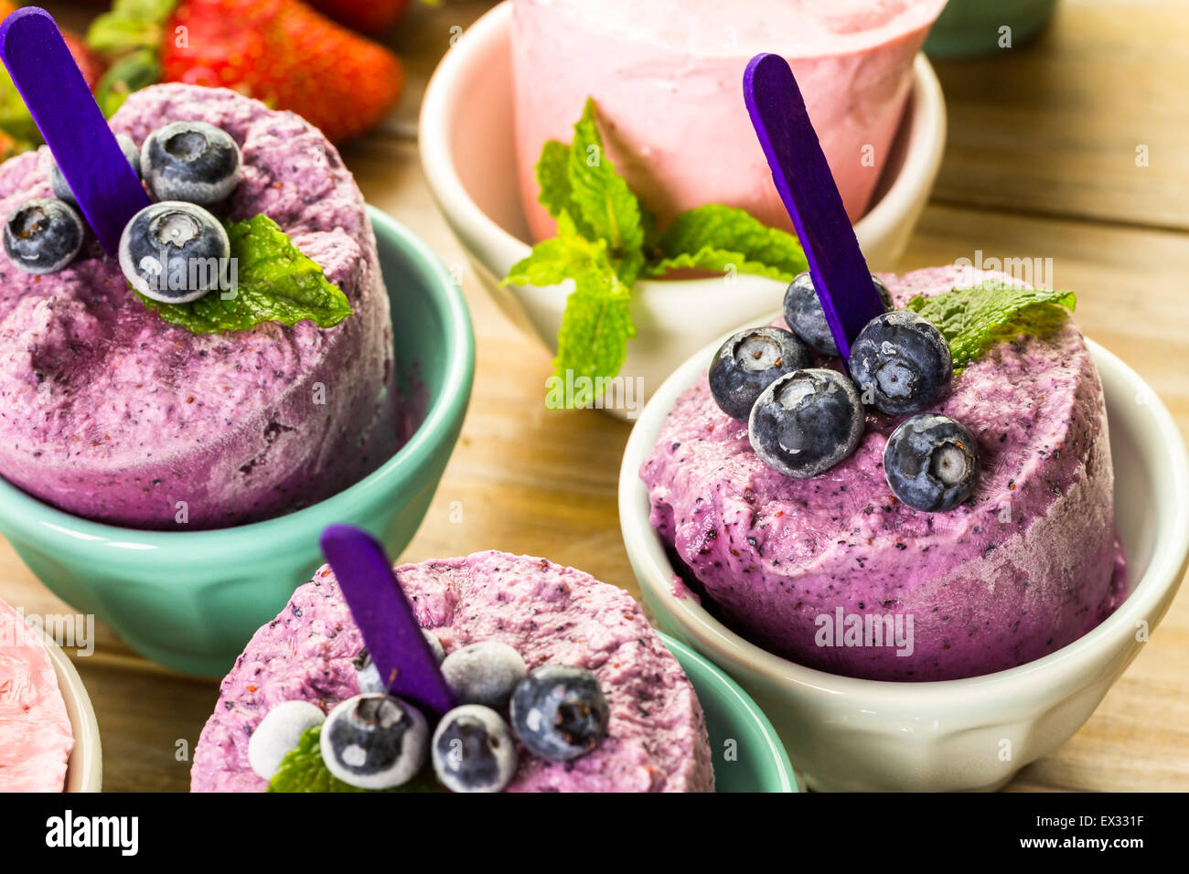 Homemade blueberry and strawberry popsicles made in plastic cups Stock Photo Alamy