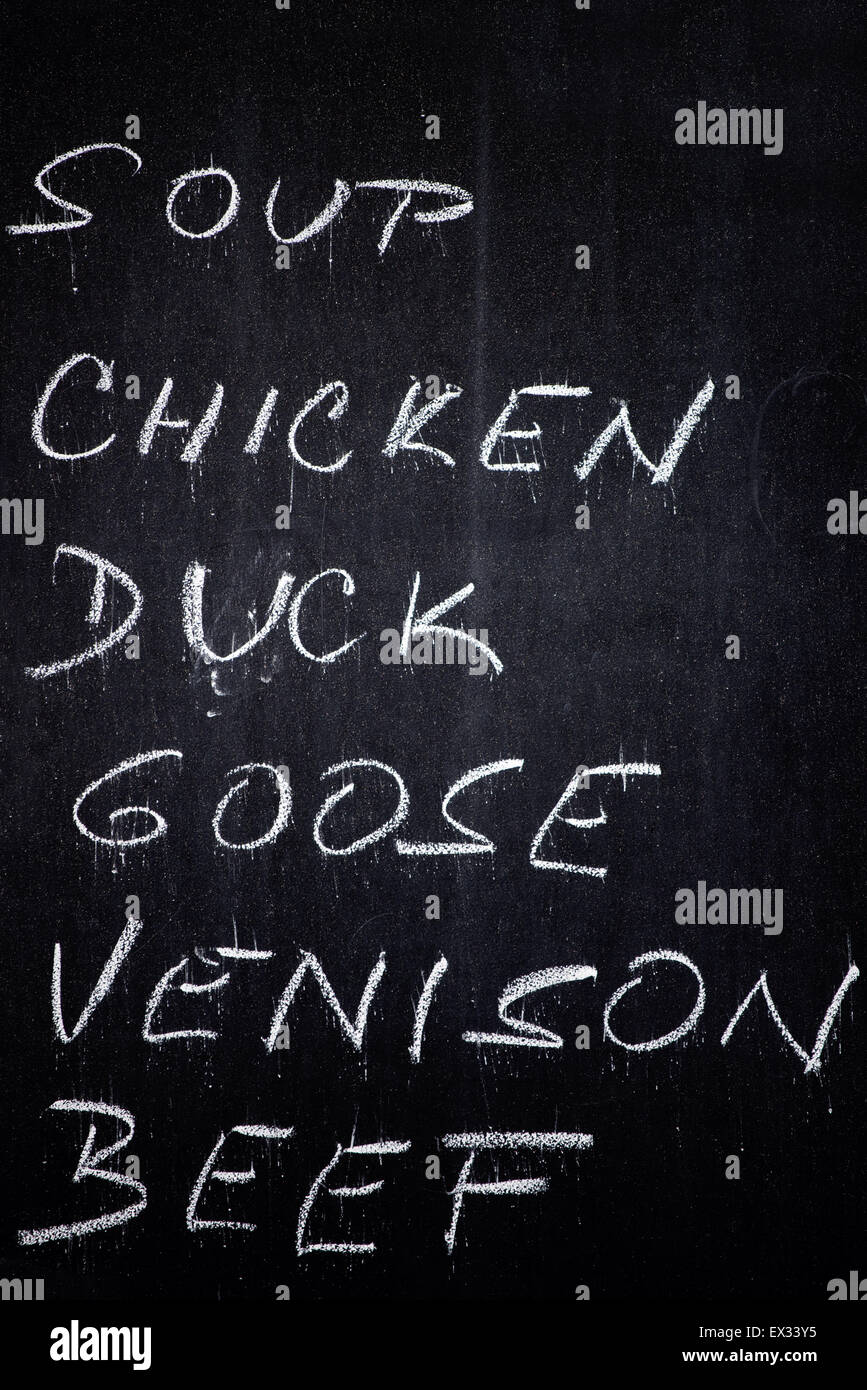Restaurant Advertising Blackboard with Beverage, Food and Drink Refreshment Drinks List Written in Chalk: Soup, Chicken, Duck, G Stock Photo