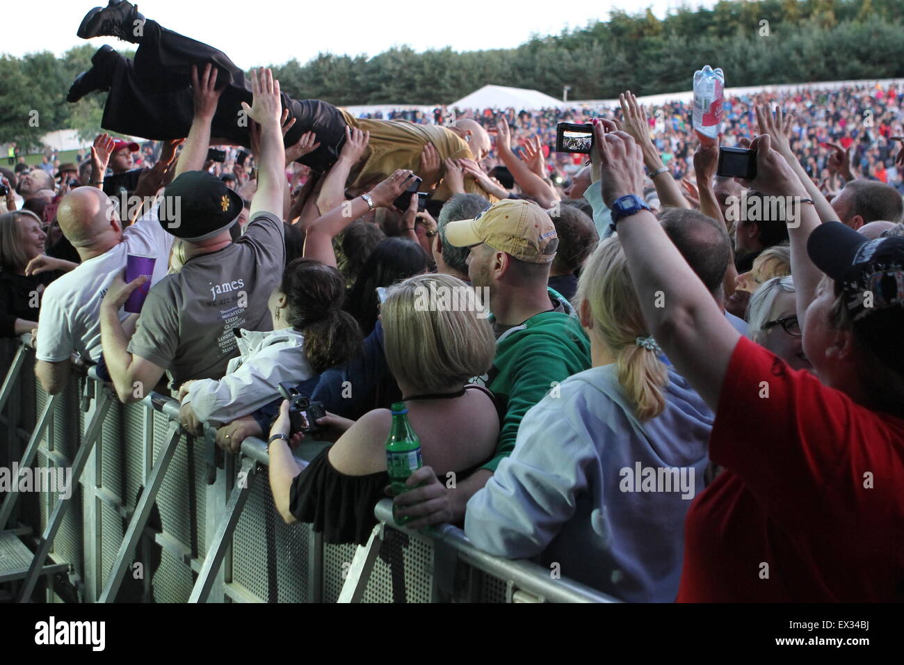 Delamere, UK. 5th July, 2015. Manchester band James performs live at Delamere Forest. Singer Tim Booth dives into the crowd during a song. Credit:  Simon Newbury/Alamy Live News Stock Photo