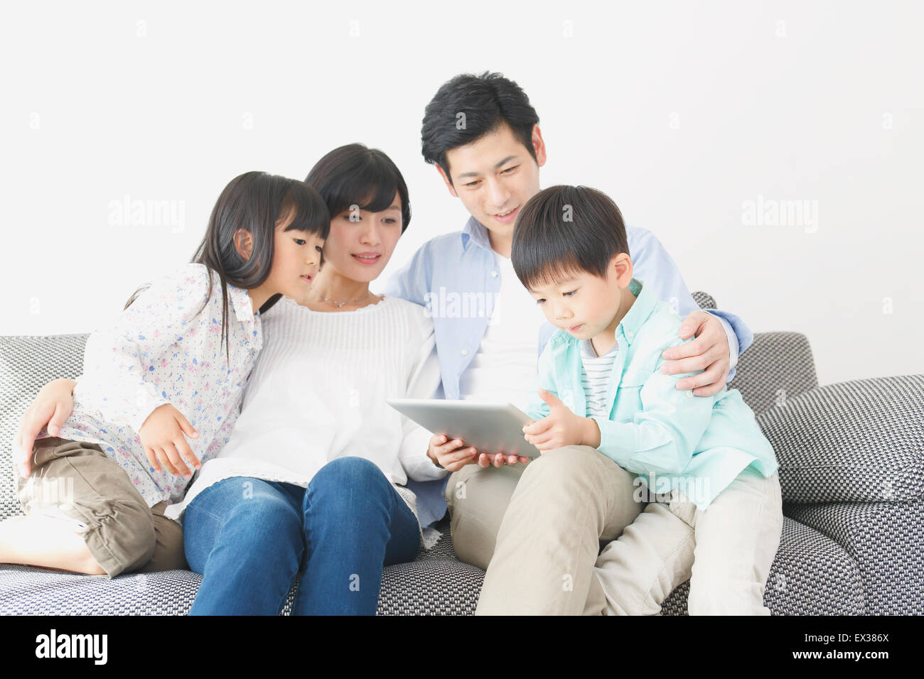 Japanese family on the sofa Stock Photo