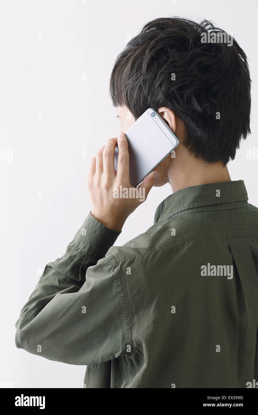 Young Japanese man on the phone Stock Photo