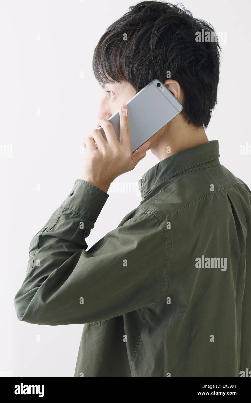 Young Japanese man on the phone Stock Photo