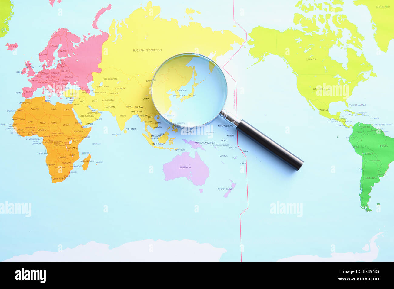 World map and magnifying glass Stock Photo Alamy