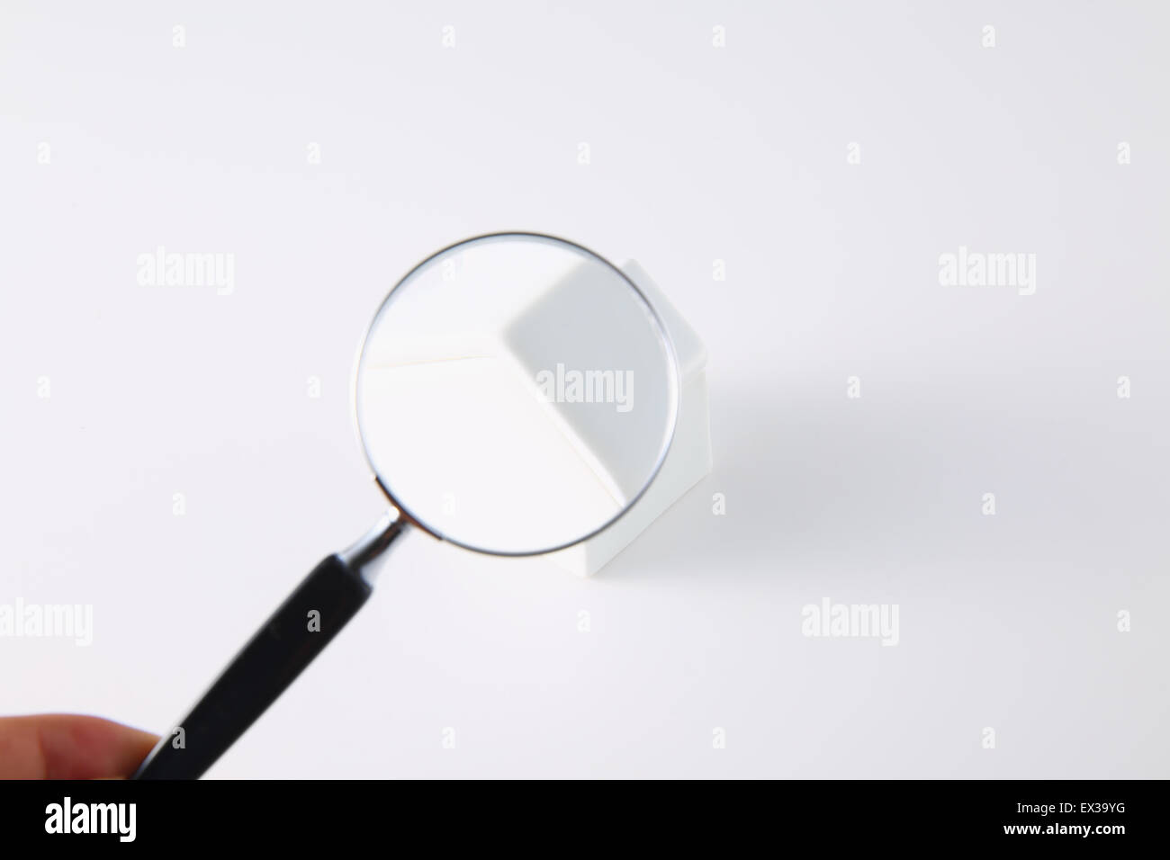 Model house and magnifying glass Stock Photo Alamy