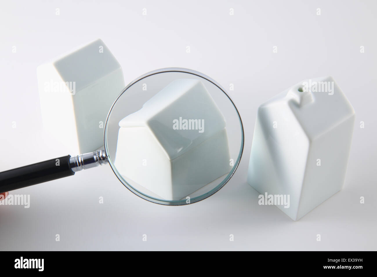 Model house and magnifying glass Stock Photo Alamy