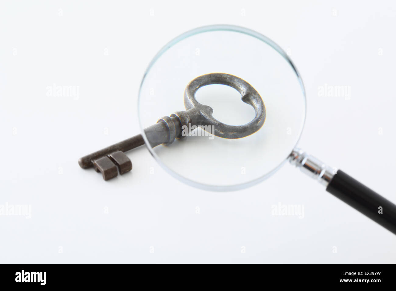 Vintage key and magnifying glass Stock Photo Alamy