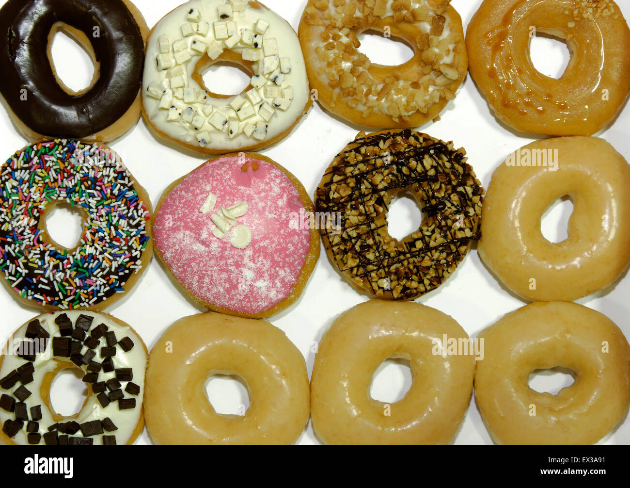 Colorful delicious donuts isolated on white background Stock Photo - Alamy