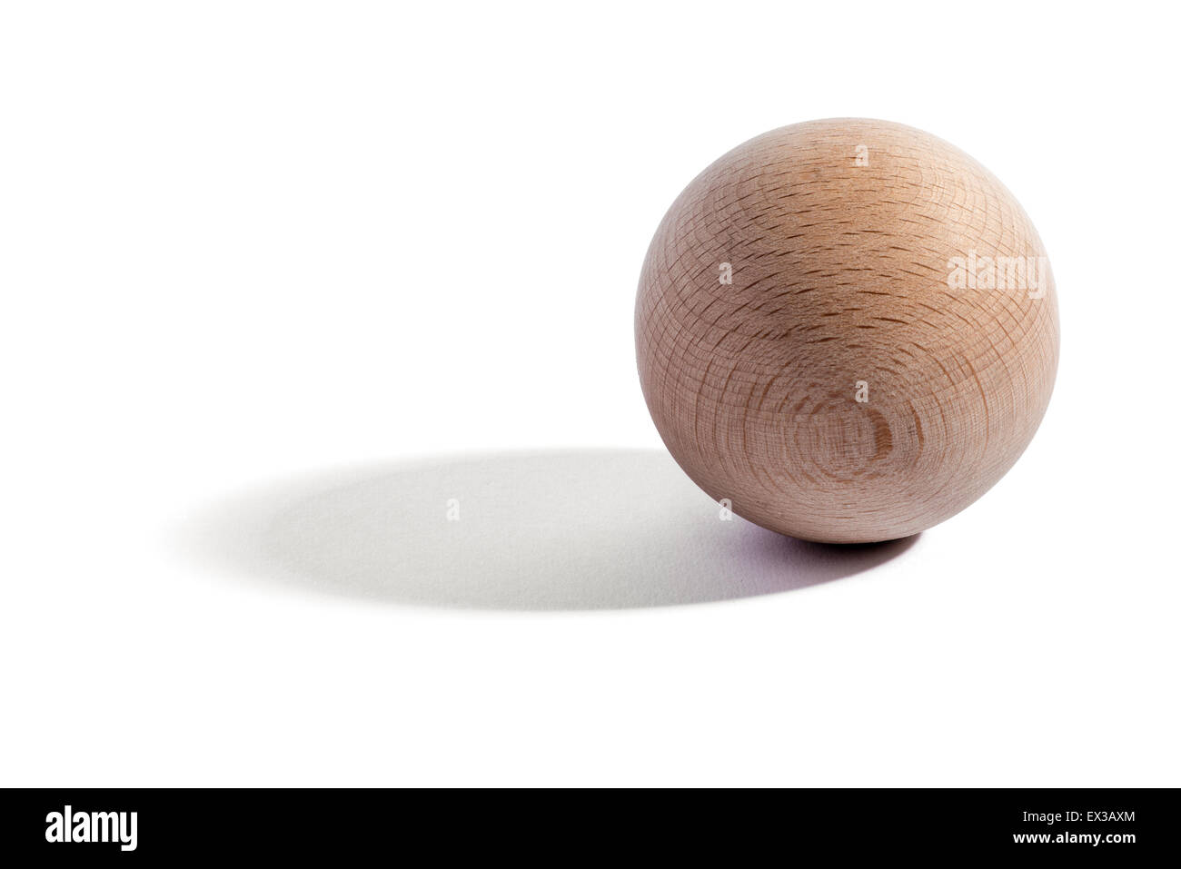 Plain natural wooden sphere or orb with wood grain over a white background with shadow and copy space Stock Photo