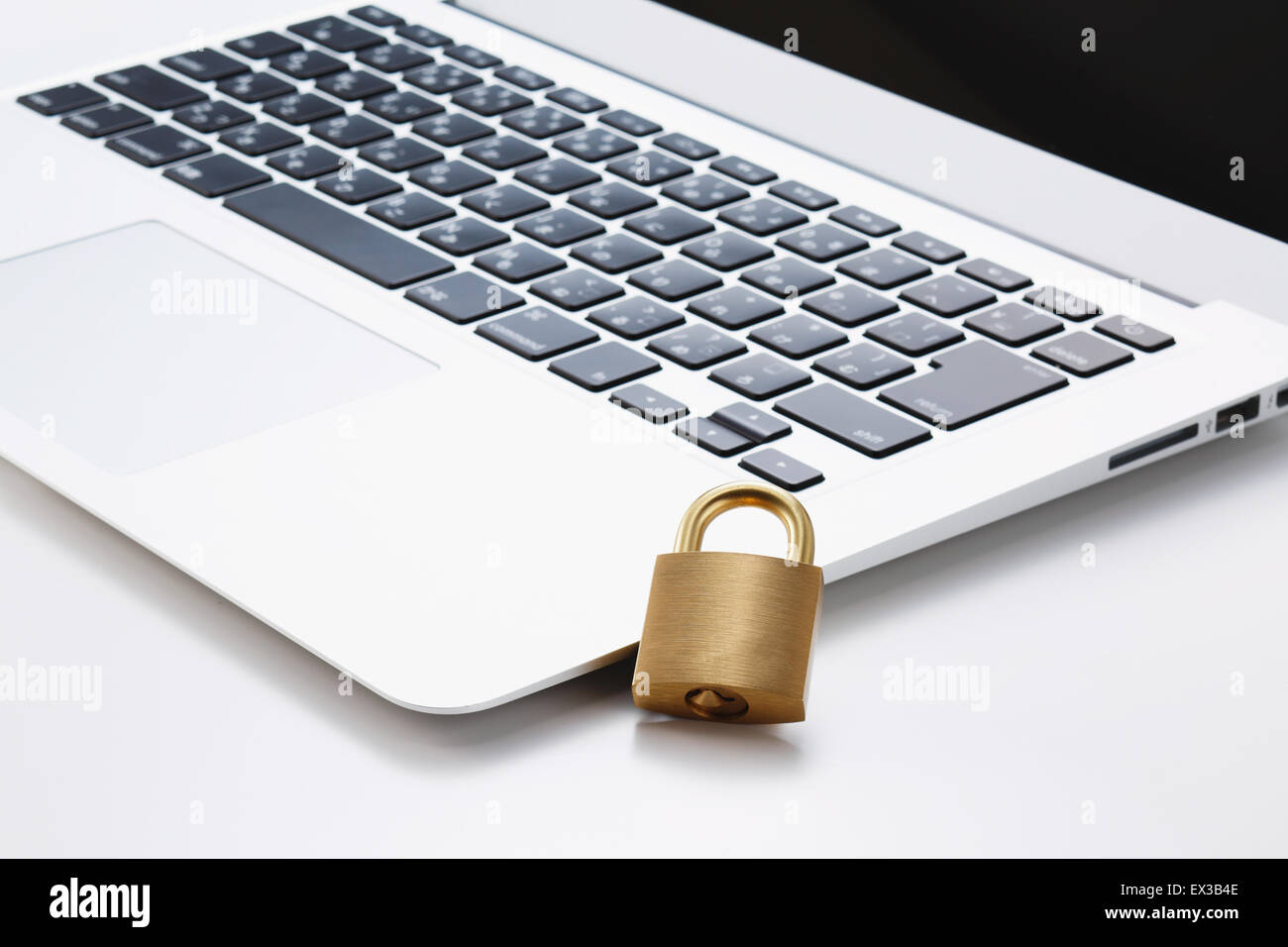 Safety lock and laptop Stock Photo Alamy