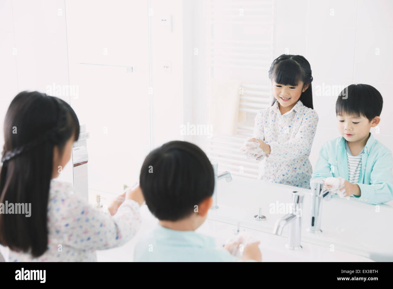 Japanese kids washing hands in the bathroom Stock Photo - Alamy