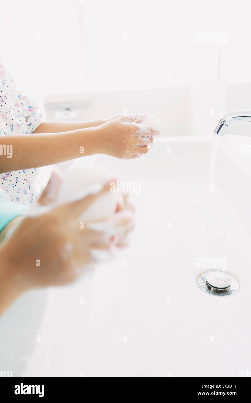 Japanese kids washing hands in the bathroom Stock Photo Alamy
