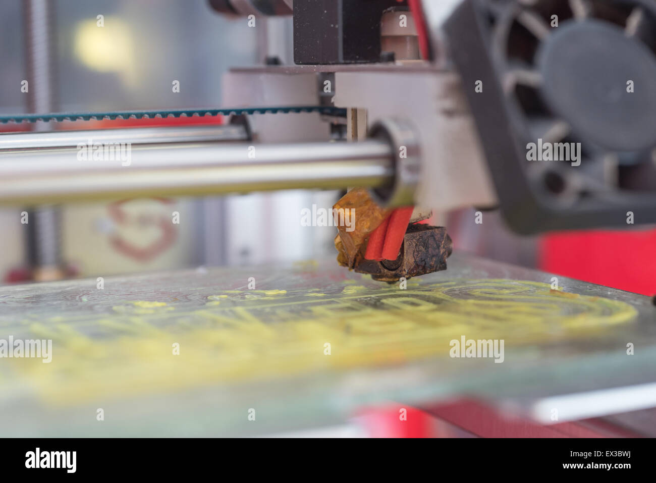 Yellow plastic piece printed in a 3D printer Stock Photo