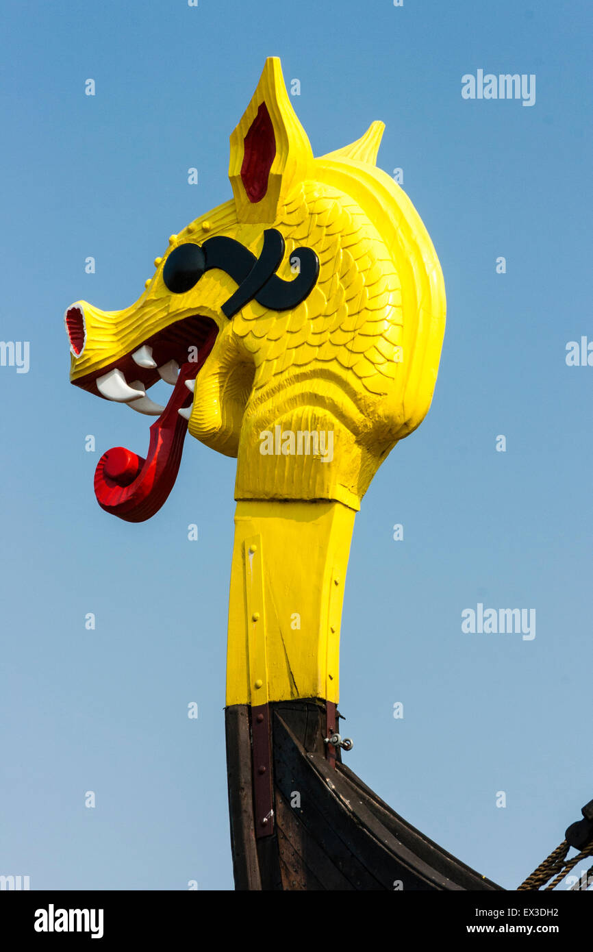 The Hugin, a reconstructed Viking ship, at Pegwell Bay, Ramsgate in England. Yellow and red dragon figurehead on the bows of the vessel. Stock Photo