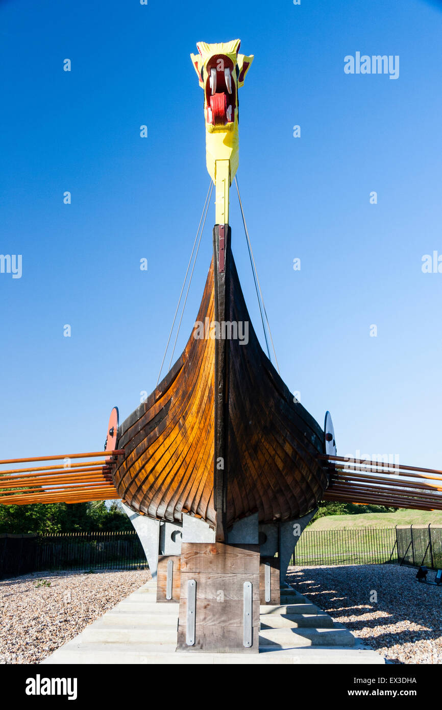 England, Ramsgate. The Hugin, a reconstructed Viking Long Boat on it's display stand at Pegwell, Ramsgate. Dragon figurehead, hull, mast and oars. Stock Photo