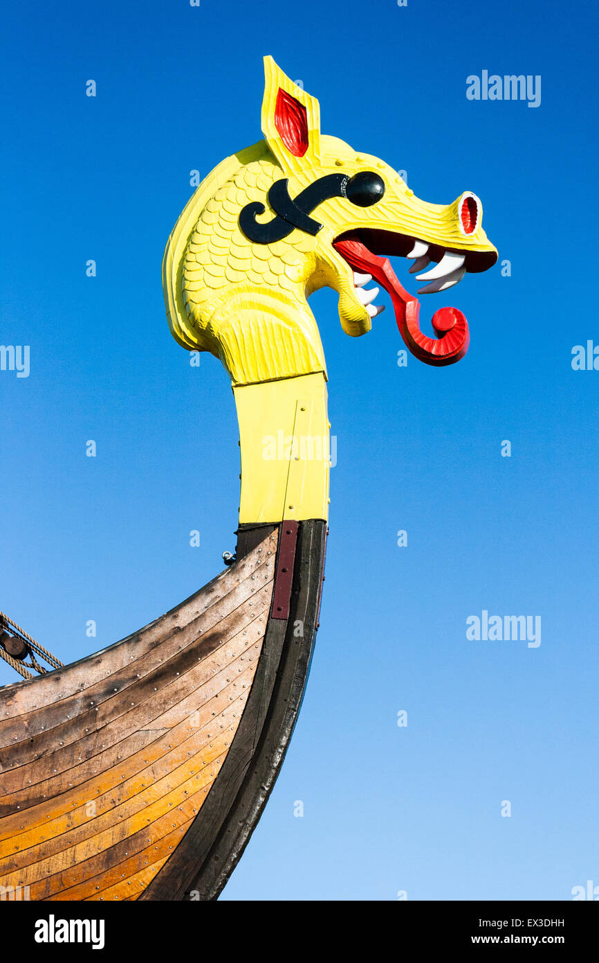The Hugin, a reconstructed Viking ship, at Pegwell Bay, Ramsgate in England. Yellow and red dragon figurehead on the bows of the vessel. Stock Photo