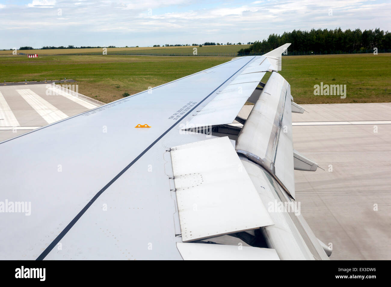 A320 Airbus Wing flaps landing on  runway Prague, Czech Republic Stock Photo