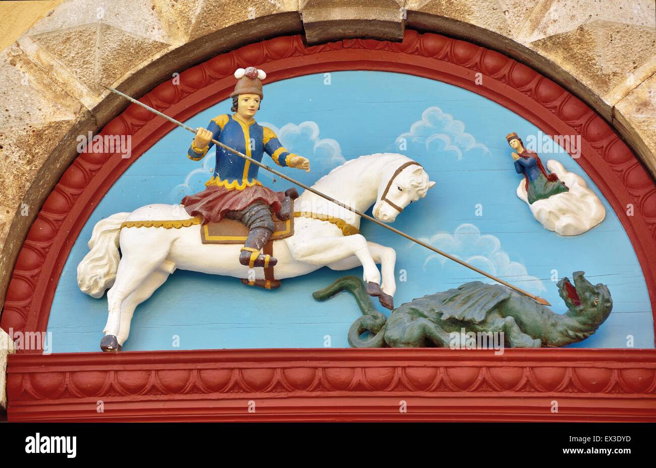 Wooden relief on the portal of the parish church of St. George ...