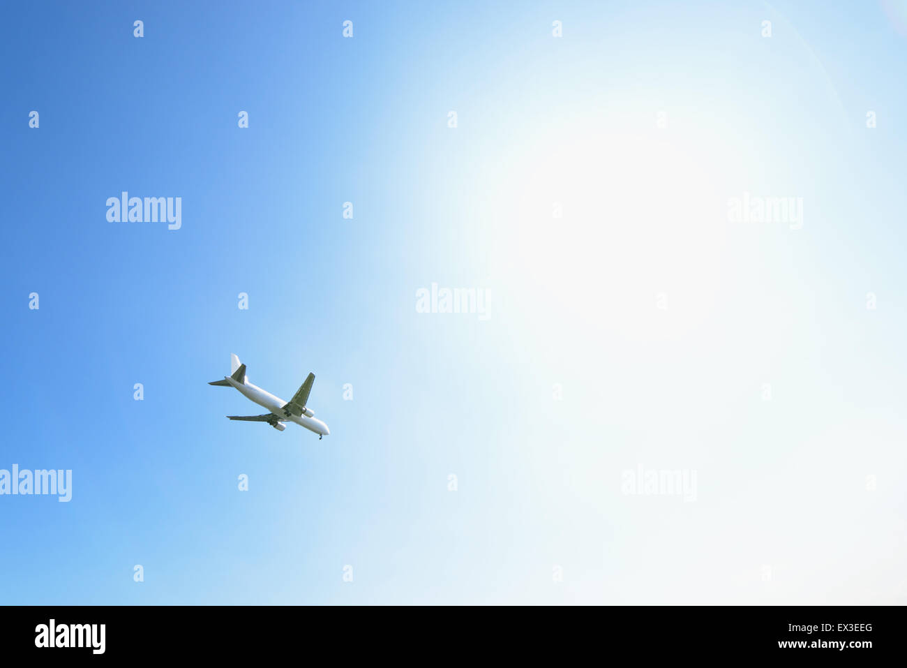 Airplane flying in the sky Stock Photo