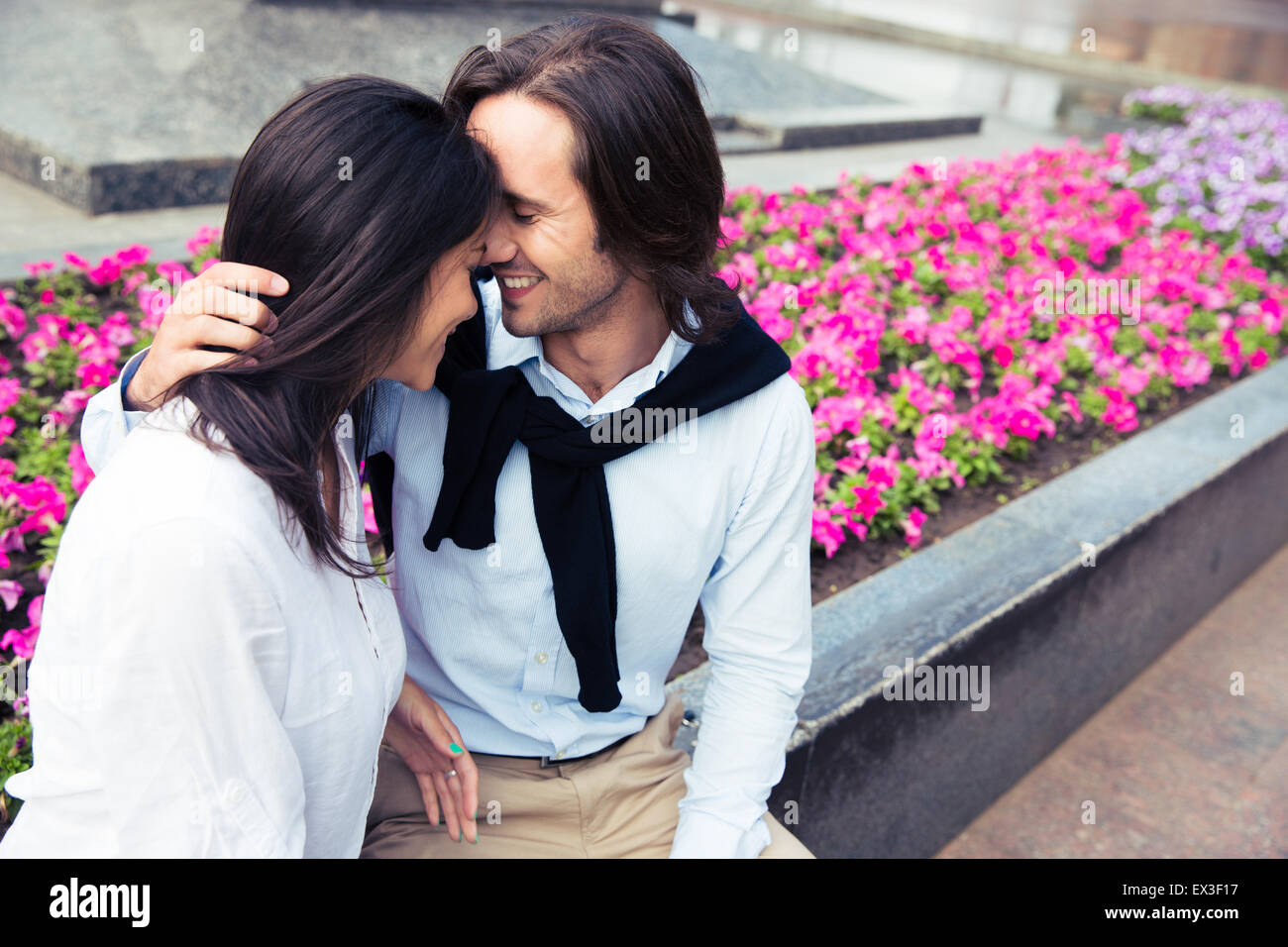 Happy romantic couple hugging outdoors Stock Photo - Alamy