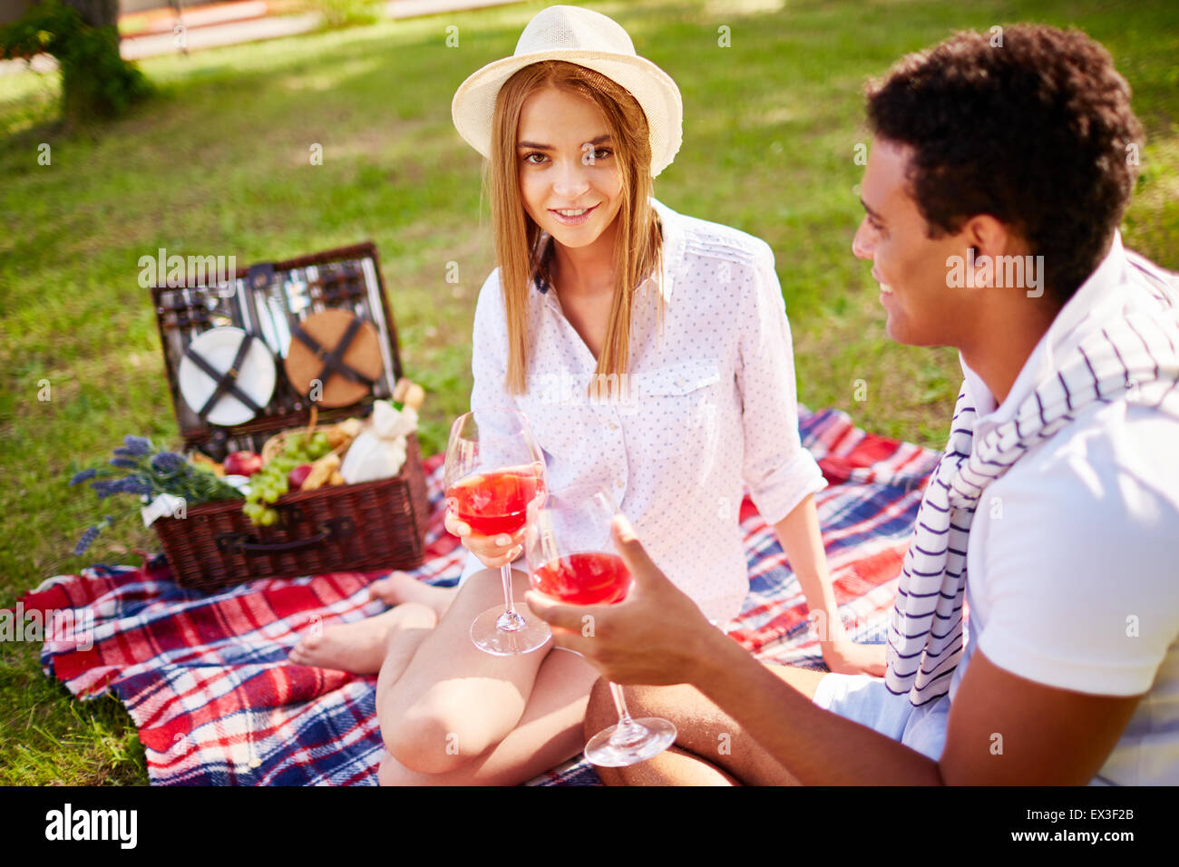 Happy young couple having romantic date in park Stock Photo