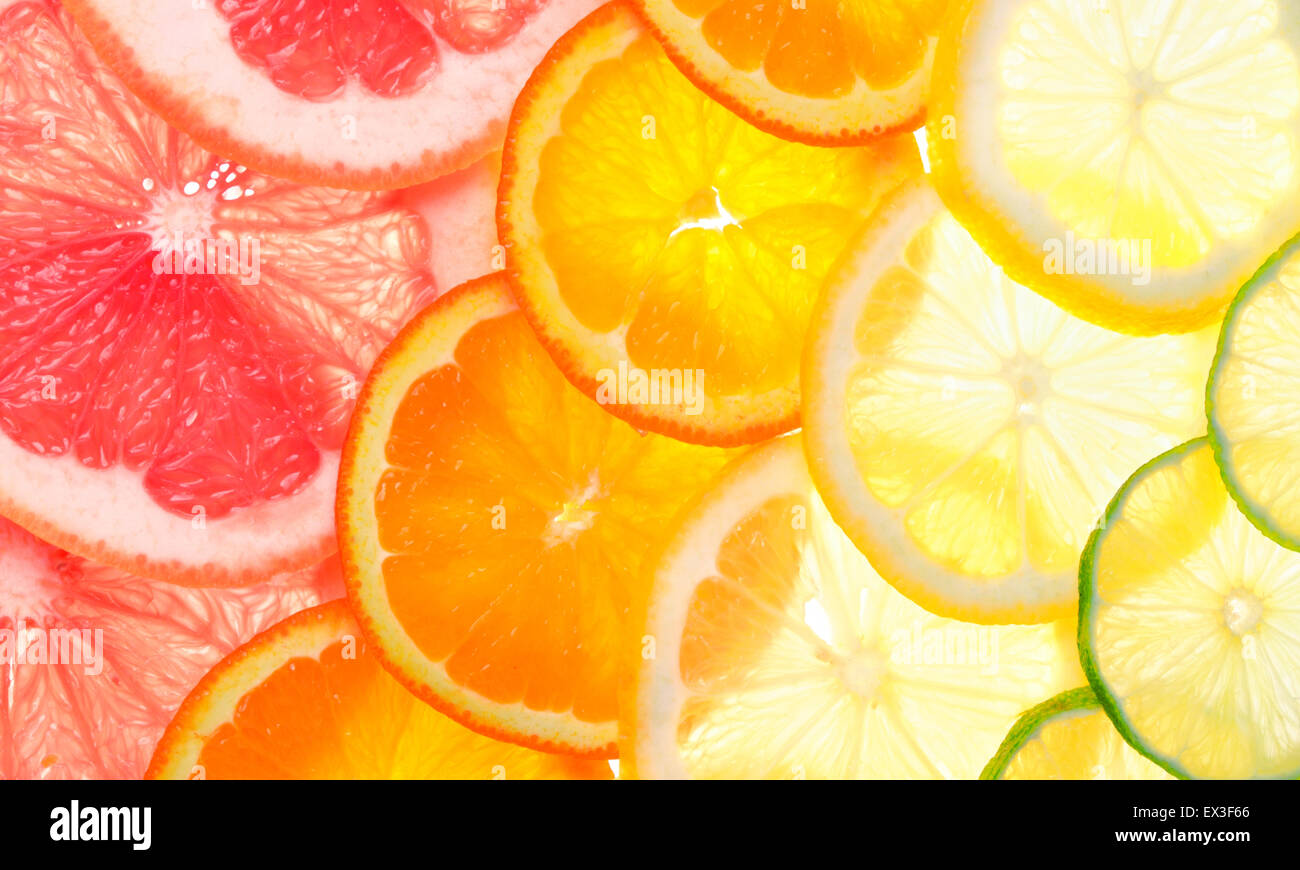 Sliced citrus fruits background (grapefruit, orange, lemon, lime) Stock Photo
