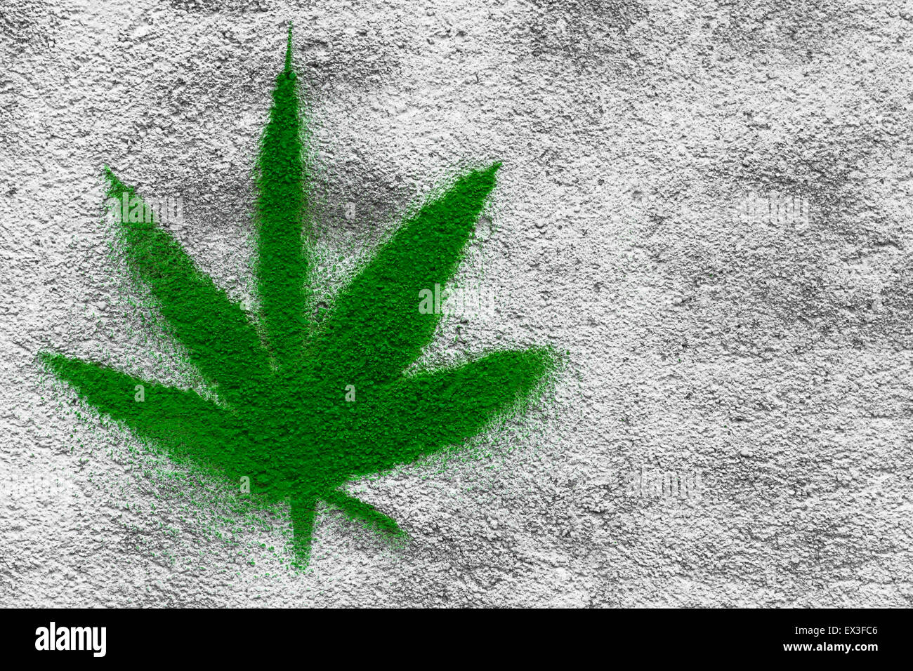 Marijuana leaf drawn on a wall with spray paint. Stock Photo