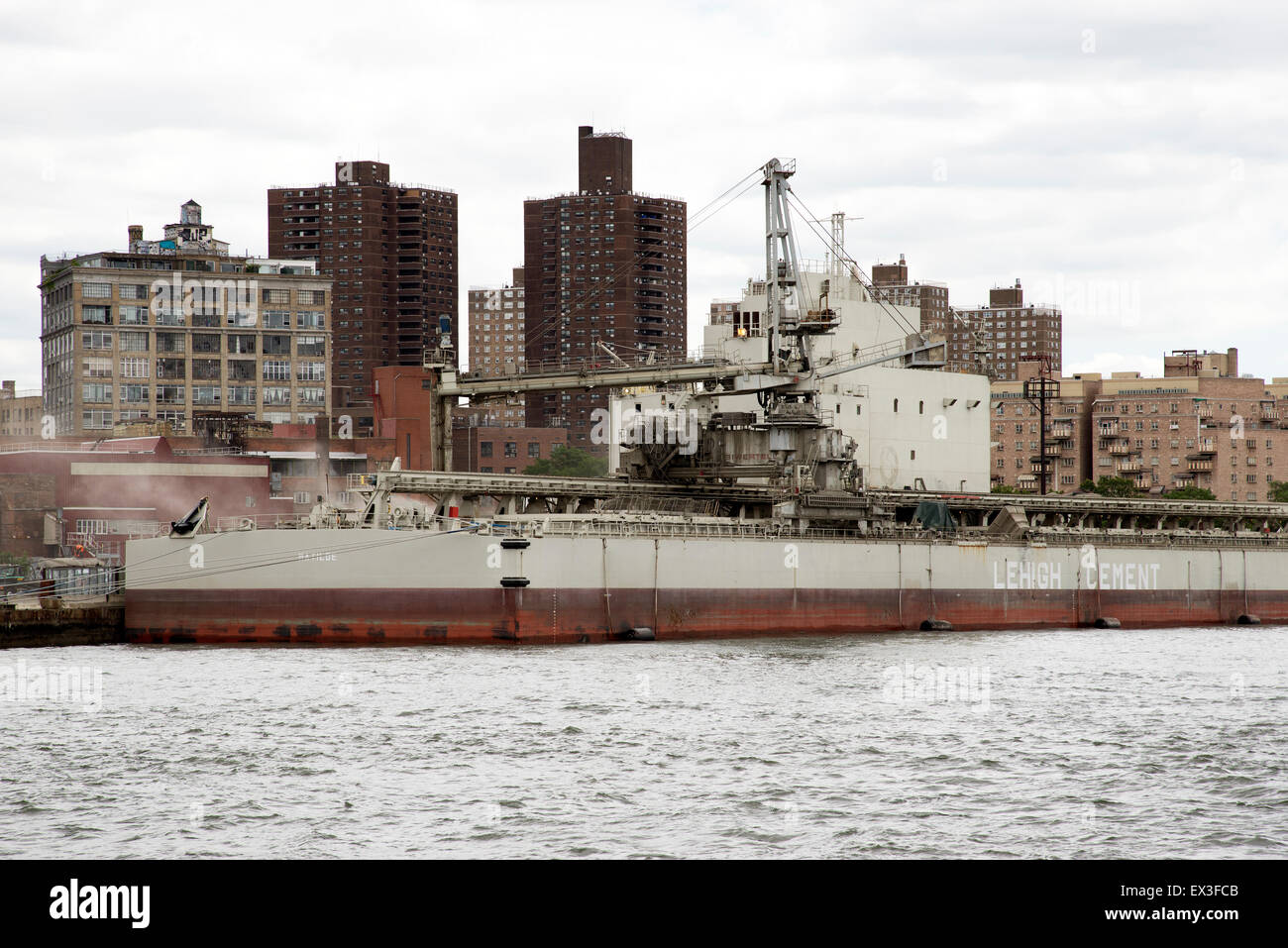 Cement barge Matilde discharging cargo East River Brooklyn NYC USA Stock Photo