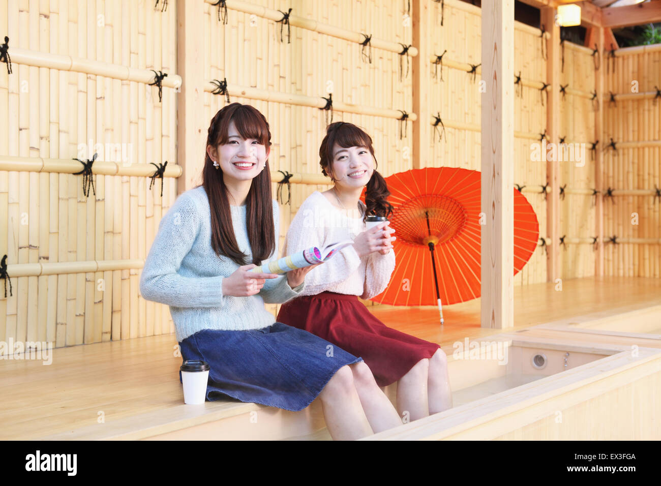 Young Japanese women enjoying foot spa in Kawagoe, Japan Stock Photo