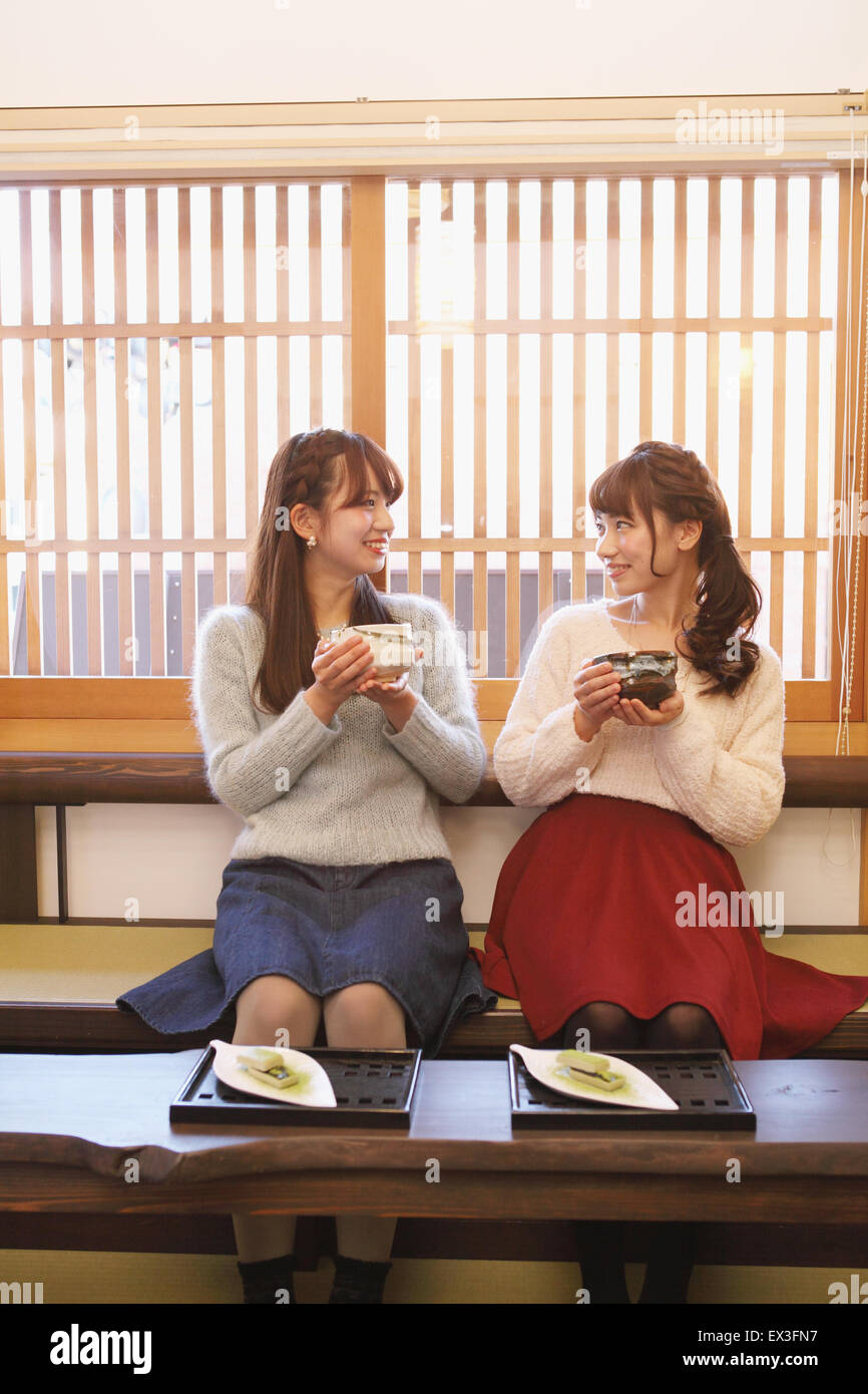 Young Japanese women enjoying Maccha green tea in Kawagoe, Japan Stock Photo