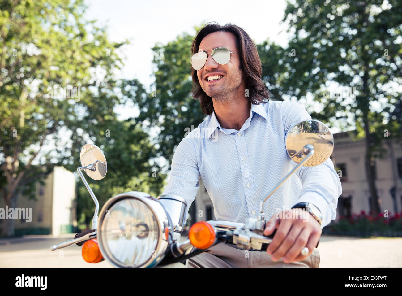 Man on scooter hi-res stock photography and images - Alamy