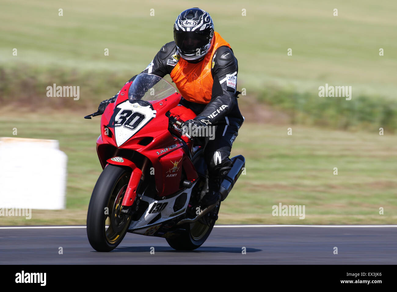 Bikers racing around Castle Combe Circuit for the Grand National Race ...