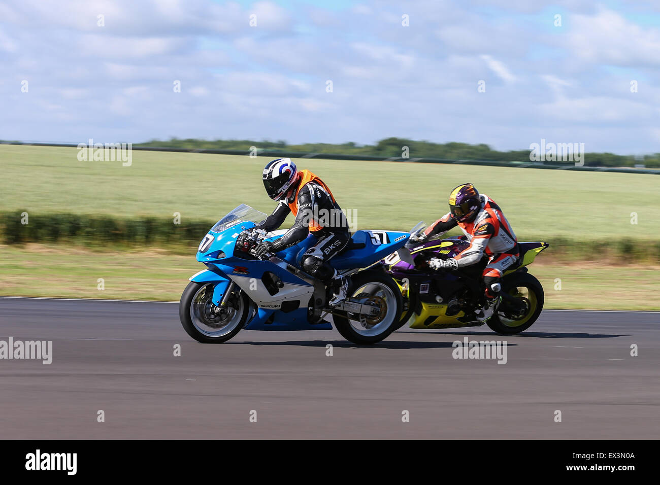 Bikers racing around Castle Combe Circuit for the Grand National Race ...