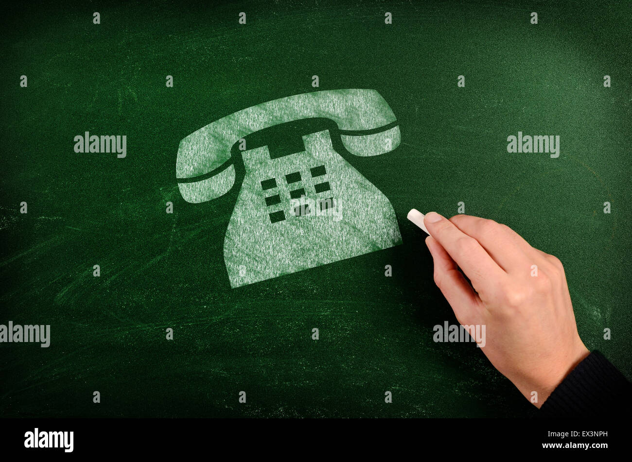 Old phone symbol drawn with chalk on green chalkboard Stock Photo
