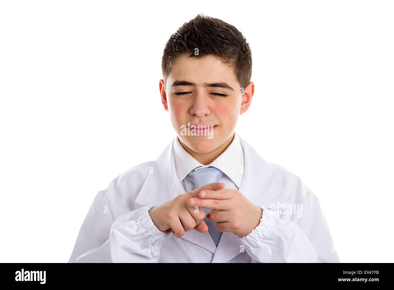 A boy doctor in blue tie and white coat helps to feel medicine more friendly: The forefinger of one hand counts off fingers of other hand meaning that the subject is well thought out. His acne skin has not ben retouched Stock Photo