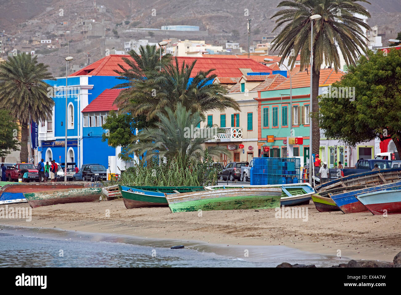 Fishing boats on beach along waterfront of old colonial historic center of the city Mindelo on São Vicente, Cape Verde, Africa Stock Photo