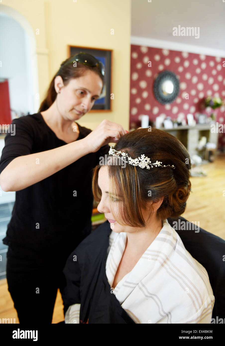 Young Bride Having Her Wedding Hair Prepared By Hairdresser At