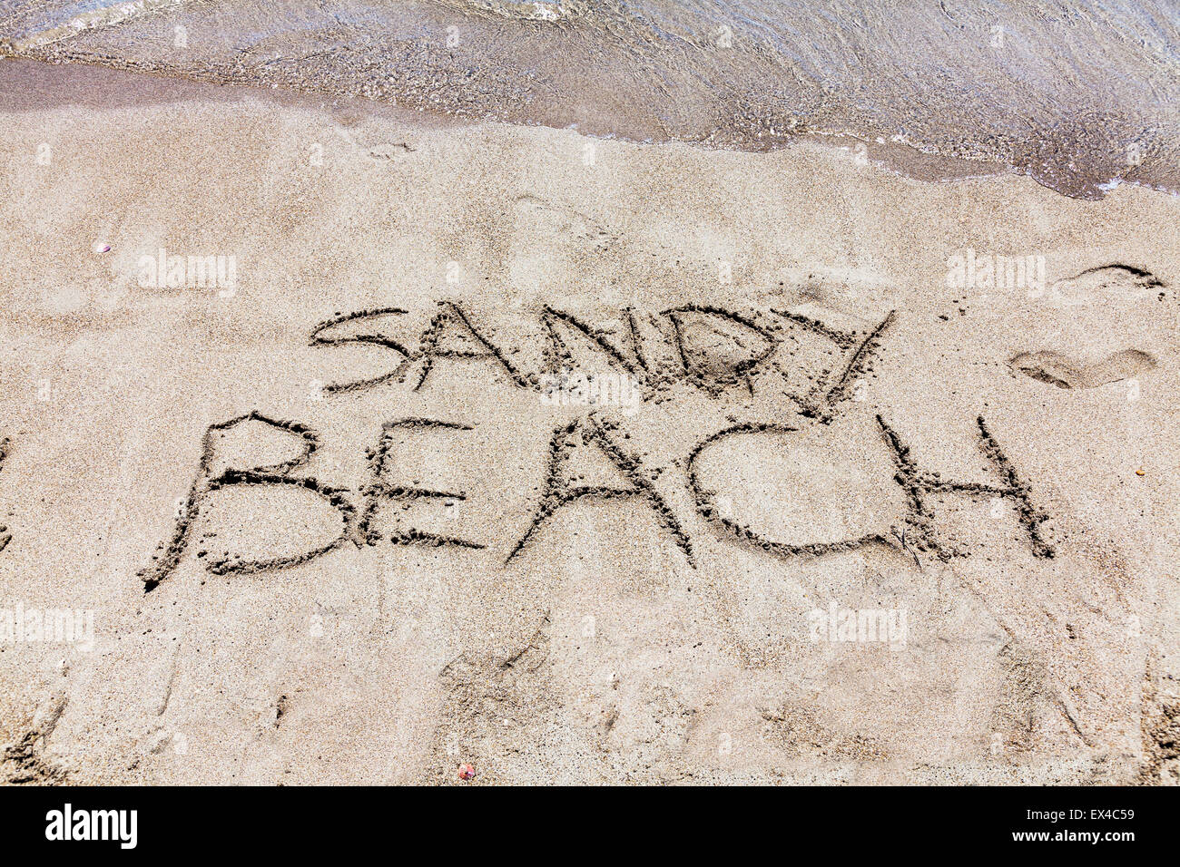 Sandy Beach words in sand written on beaches Spanish fun resorts resort seas coast holiday
