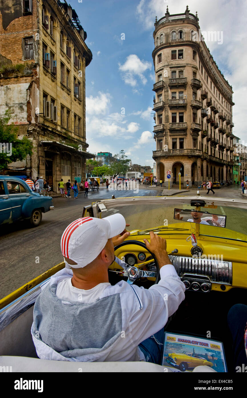 Vertical view driving down Avenue Zanja in Havana in a Chevrolet cabriolet, Cuba. Stock Photo