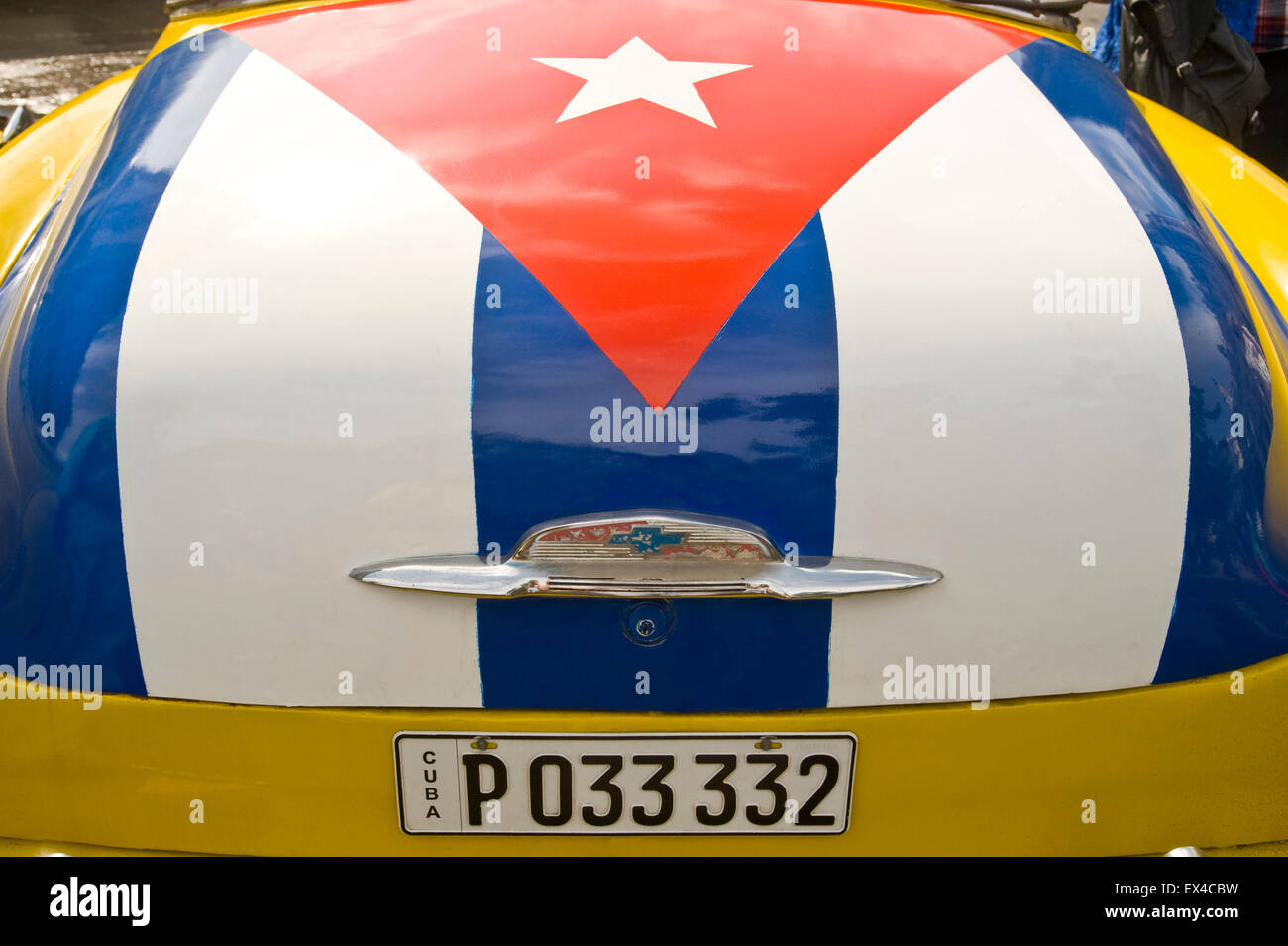 Horizontal close up view of a Cuban flag painted on the boot of a 1951 Chevrolet Styleline DeLuxe Bel Air in Havana, Cuba. Stock Photo
