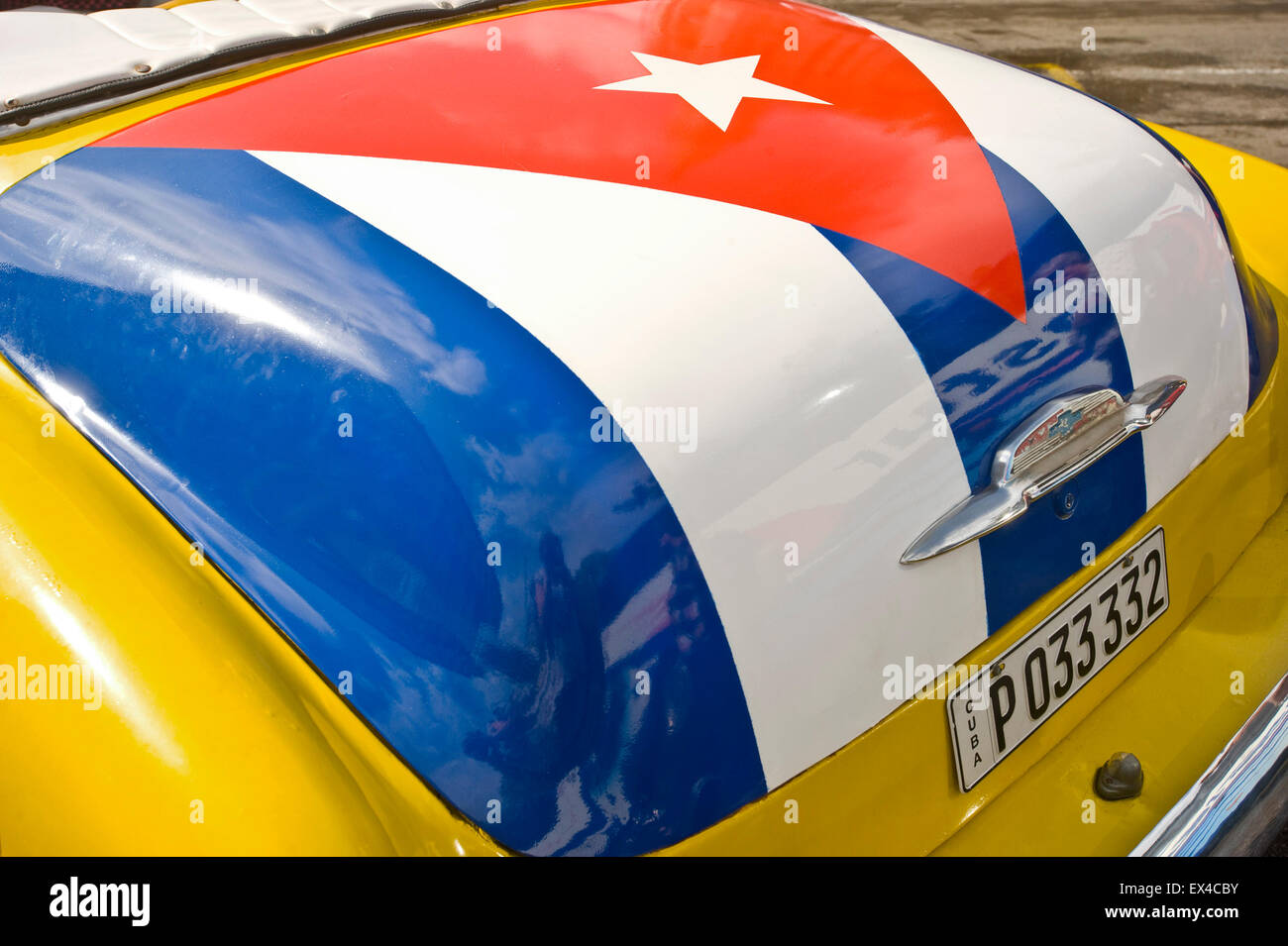 Horizontal close up view of a Cuban flag painted on the boot of a 1951 Chevrolet Styleline DeLuxe Bel Air in Havana, Cuba. Stock Photo