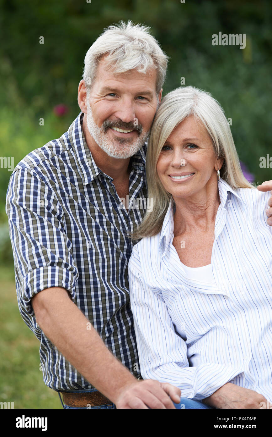 Portrait Of Mature Couple Relaxing In Garden Together Stock Photo - Alamy