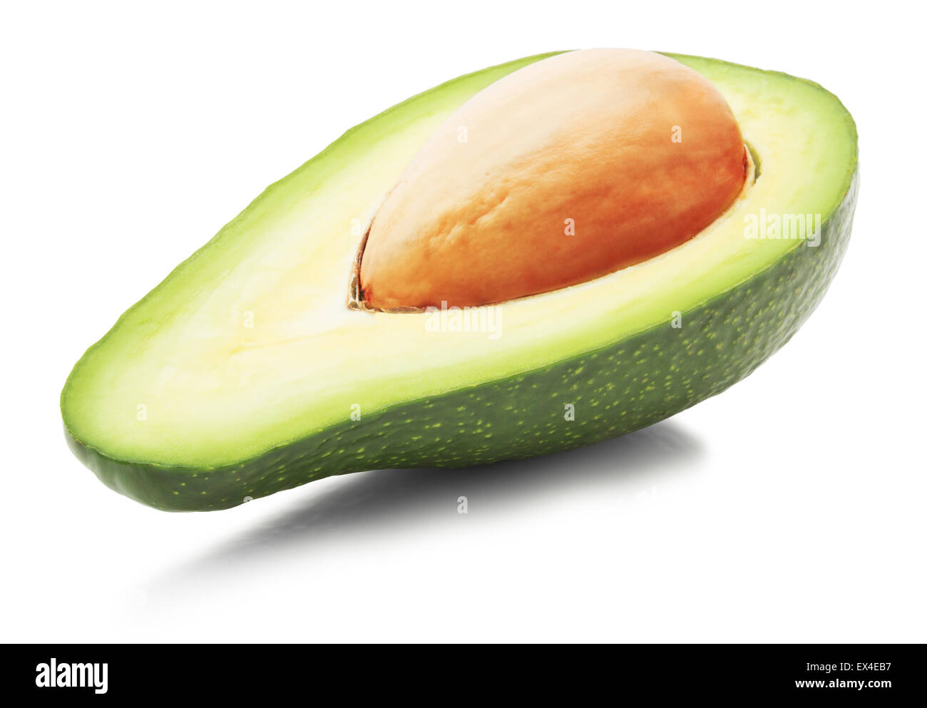 half of green avocado isolated on the white background. Stock Photo