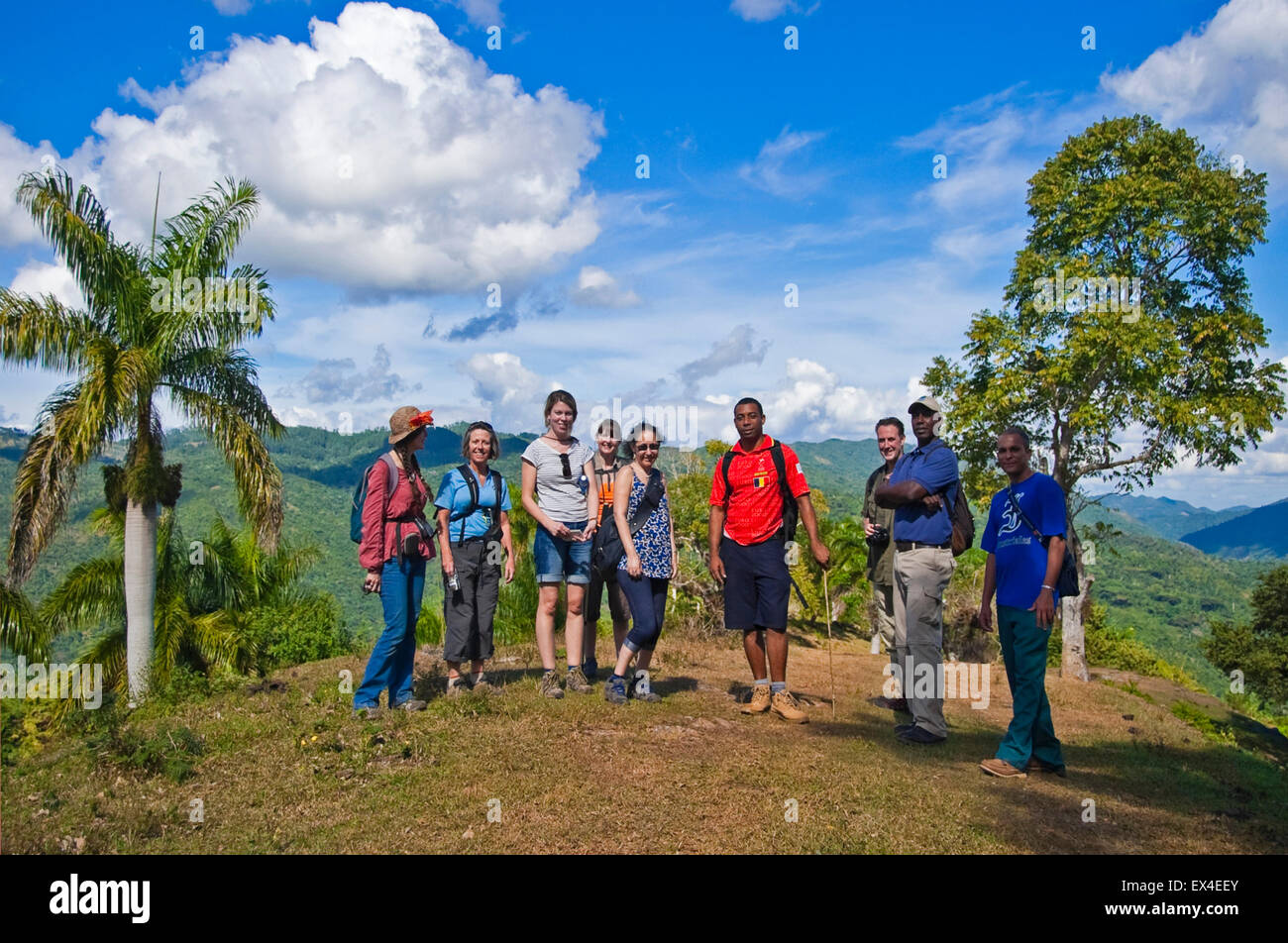 Horizontal portrait of a group of tourists and their tour leader in Topes de Collantes National Park in Cuba. Stock Photo