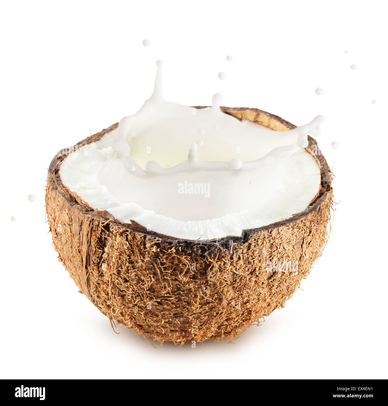 Coconuts with milk splash on white background. Stock Photo