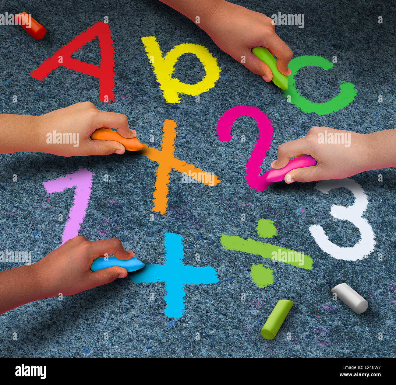 Education community learning concept as a group of children holding chalk writing and drawing reading and math symbols on pavement as a metaphor for working together in friendship for school support. Stock Photo