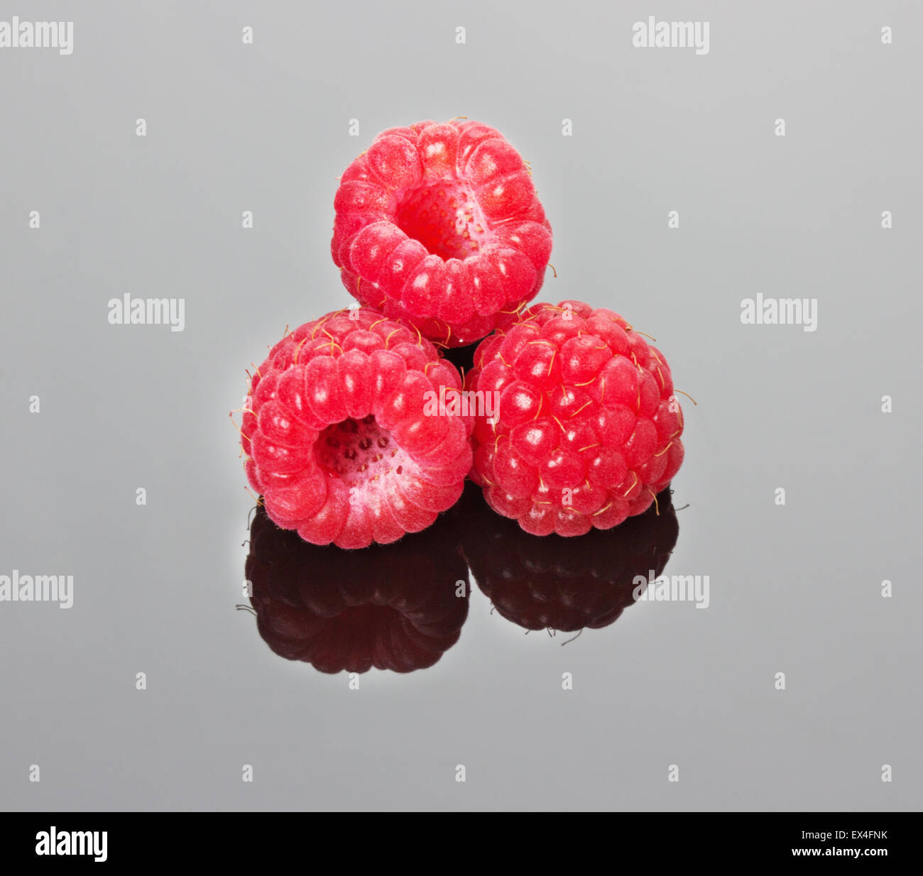 Juicy Raspberry juicy raspberries on the grey background Stock Photo - Alamy