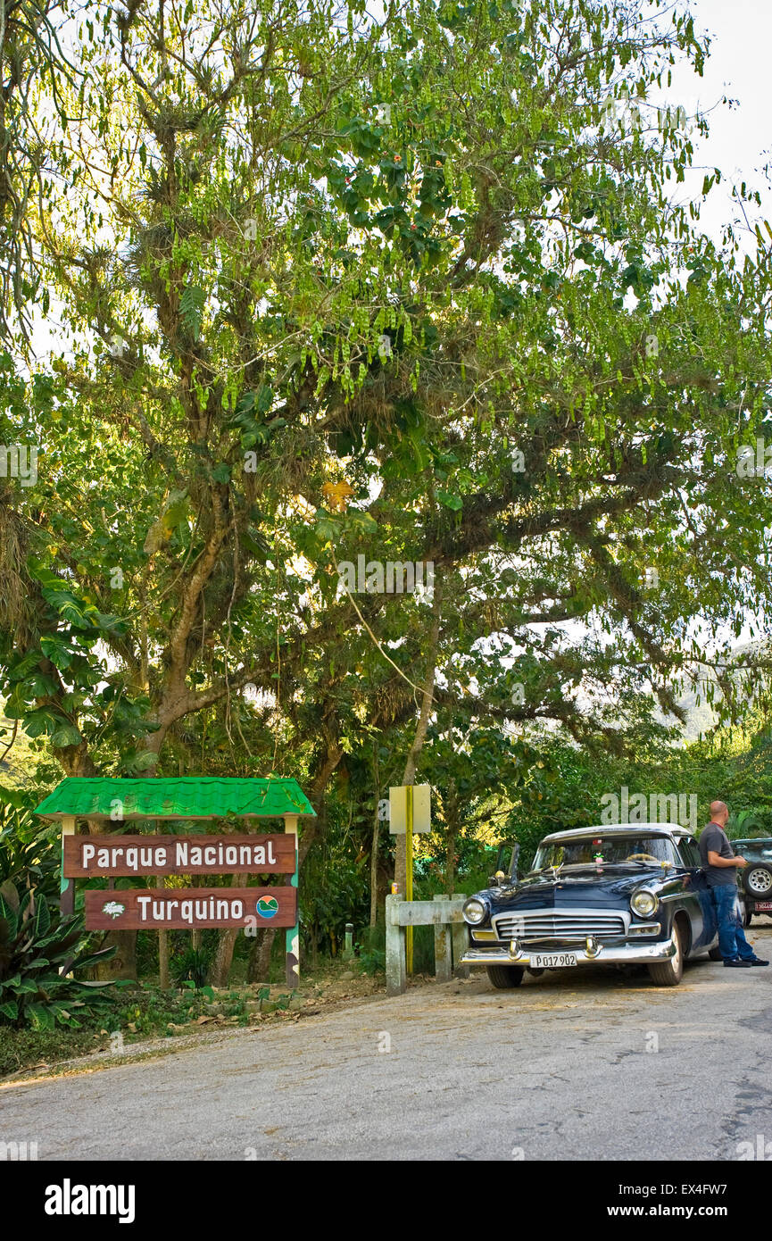 Vertical view of a vintage Chrysler car at the entrance to Turquino National Park, Cuba. Stock Photo