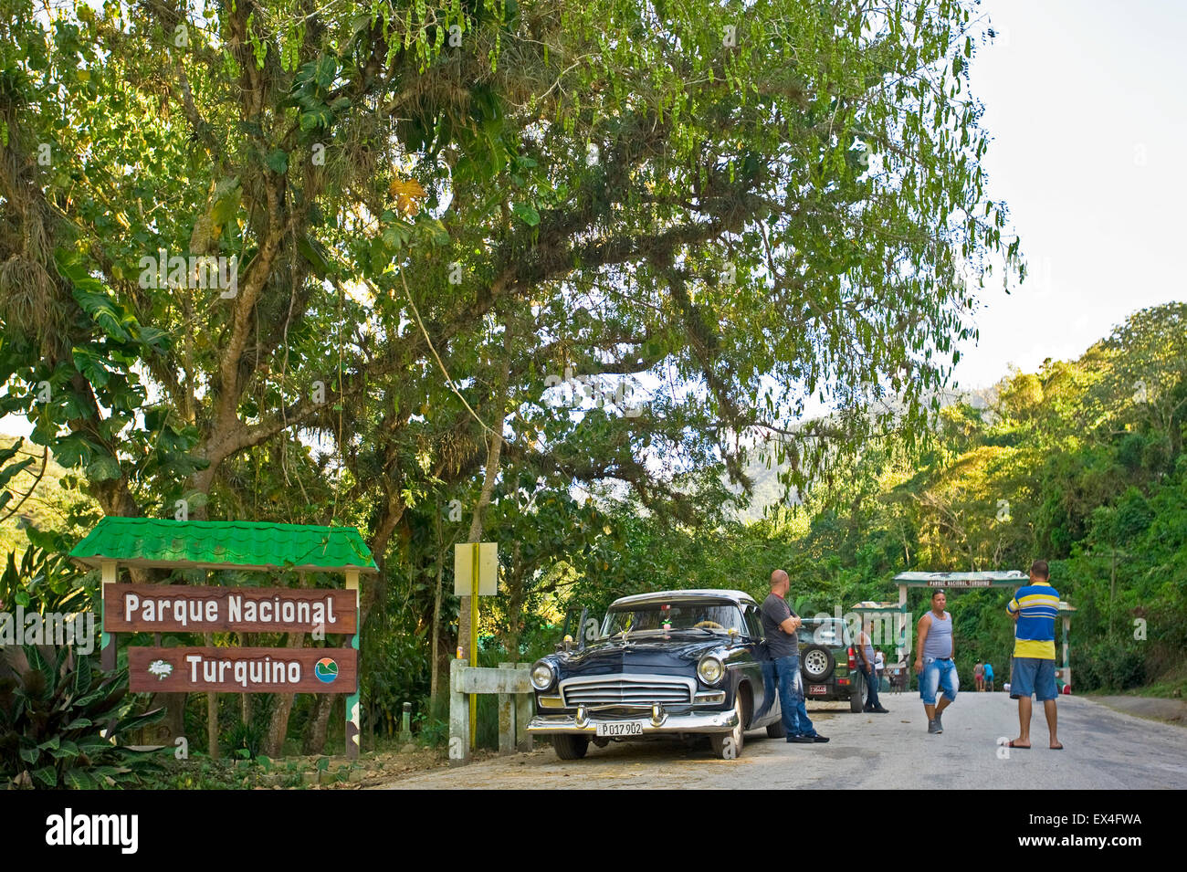 Horizontal view of an old Chrysler car waiting at the entrance to Turquino National Park, Cuba. Stock Photo