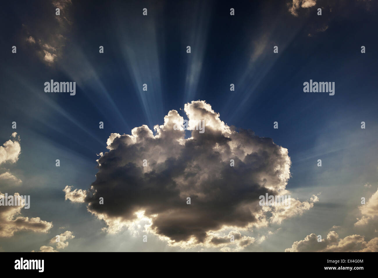 Sunbeams going out from beahind the clouds Stock Photo