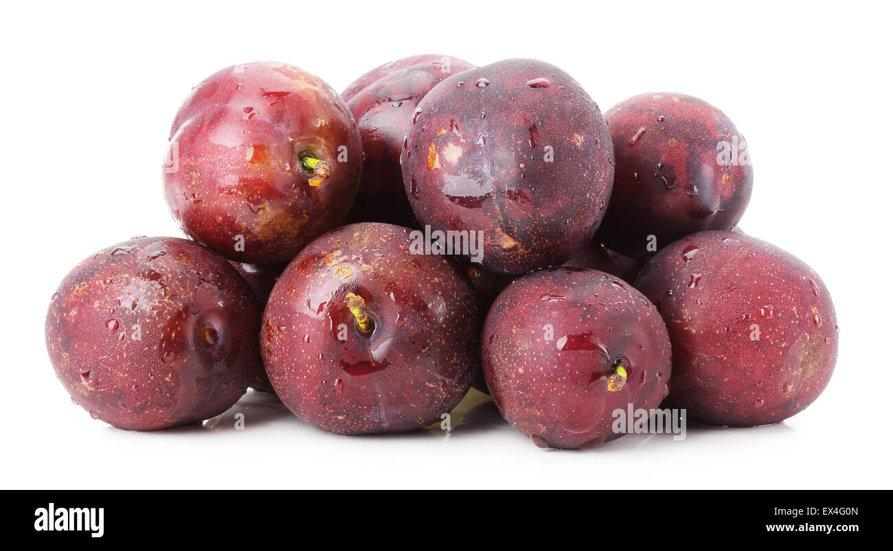 purple plums group isolated on the white background. Stock Photo